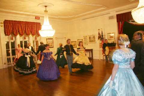 Ladies dressed in satin and gentlemen dressed to impress, dance the Rustic Reel.