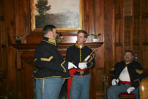 Corp. Larry Niehaus discusses the fine points of bugling with Dennis Jones, while Sgt. Gary Niehaus observes.