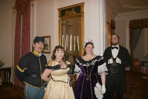 Mr. and Mrs. Lincoln receive and welcome guests to the ball.